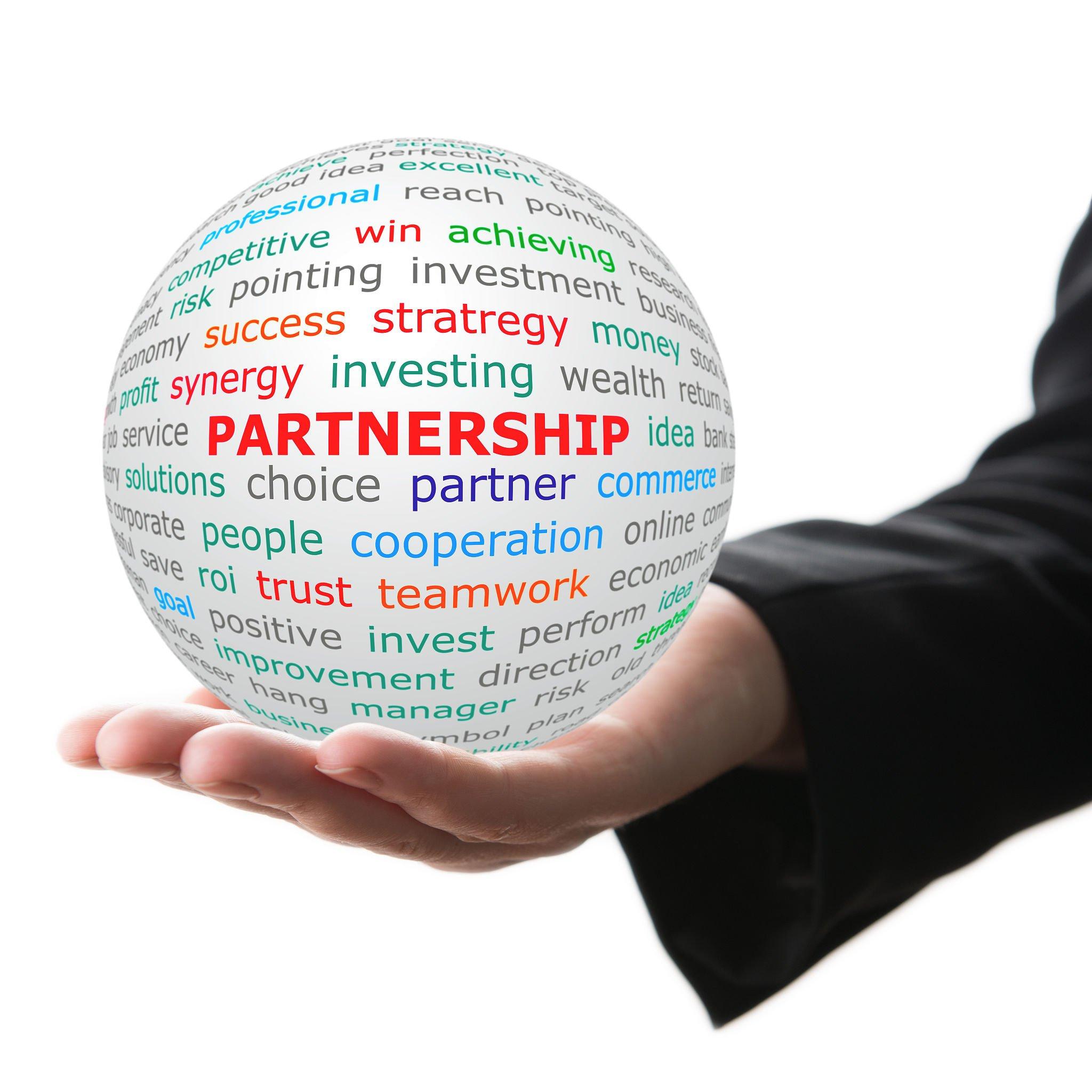 Partnership concept. Hand take white ball with wordcloud and Partnership word in red color